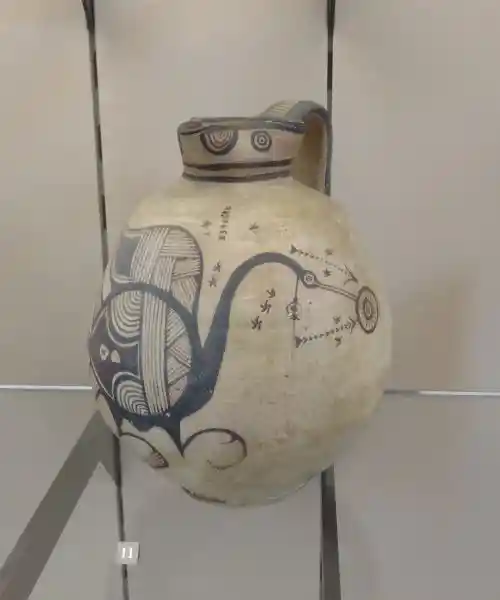 Solar disc and a bird design on a jug